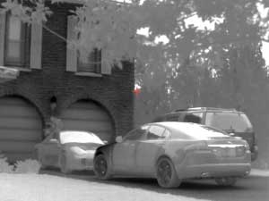 thermal clip-on rifle scope image of cars
