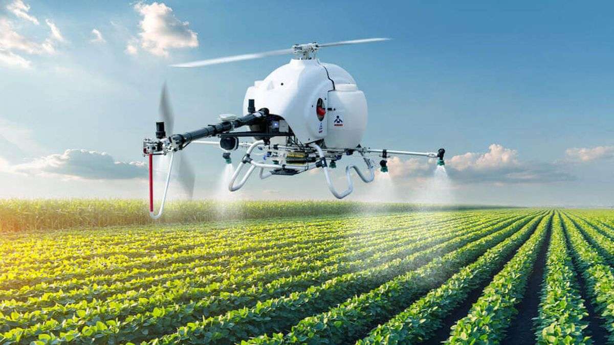 agriculture helo drone spraying a field